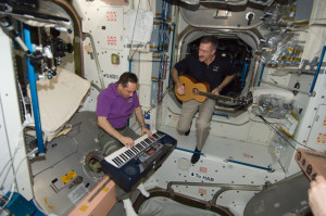Astronaut Dan Burbank and cosmonaut Anton Shkaplerov make music on ISS in 2012 (Credits: NASA).