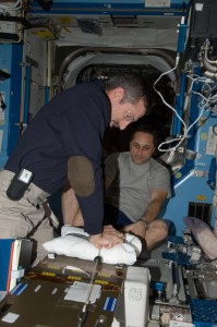 NASA astronaut Dan Burbank and Russian cosmonaut Anton Shkaplerov participate in a Crew Health Care System medical contingency drill in the Destiny laboratory of the International Space Station. This drill gives crewmembers the opportunity to work as a team in resolving a simulated medical emergency onboard the space station (Credits: NASA).