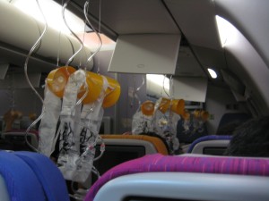 oxygen masks deployed on a plane