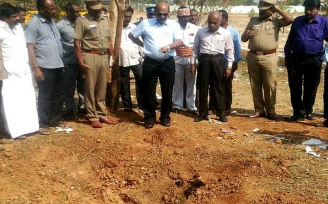 Officials inspect the site of a meteorite strike at a college in Vellore, India. credits: India Today